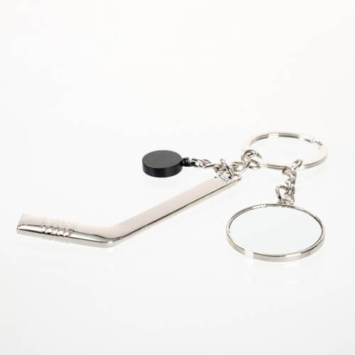 A metal key ring with a puck and a hockey stick for sublimation