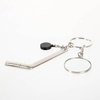 A metal key ring with a puck and a hockey stick for sublimation