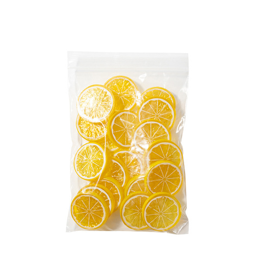 Artificial lemon slice with yellow peel