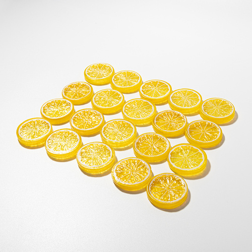 Artificial lemon slice with yellow peel