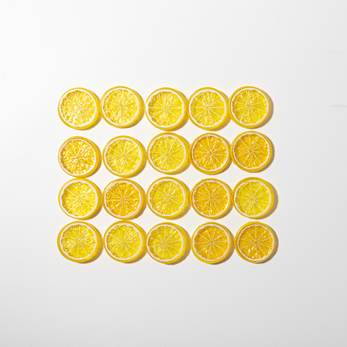 Artificial lemon slice with yellow peel