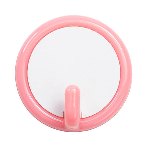 Una pequeña percha de plástico para sublimación - circulo rosa